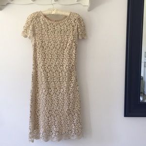 Ivory and gold lace dress.